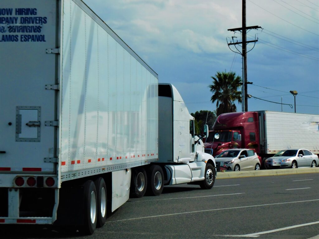 White semi truck on highway – handled by Semi Truck Accident Lawyer at Adolphe Law Group